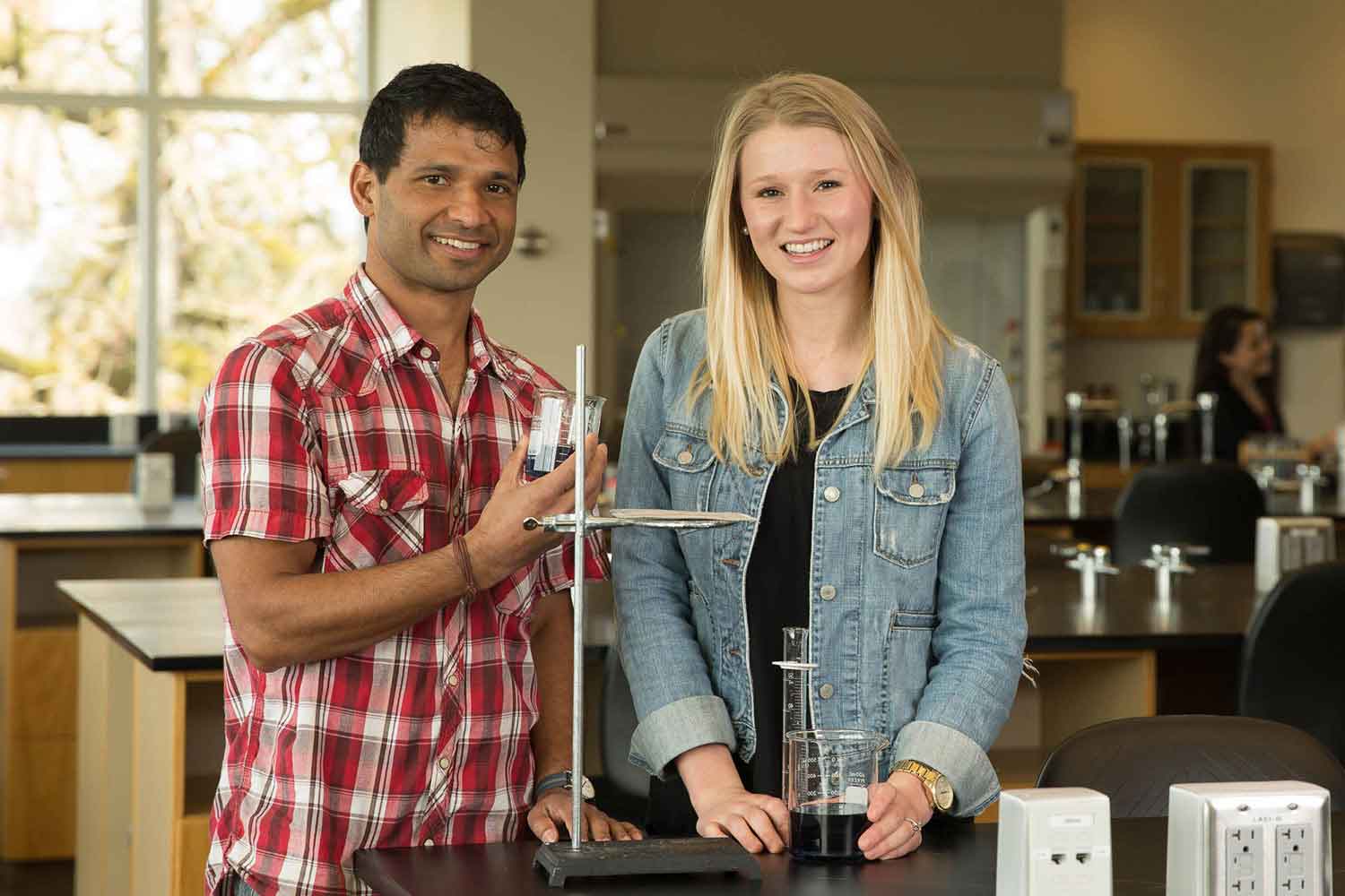 Two students in a Chemistry Lab
